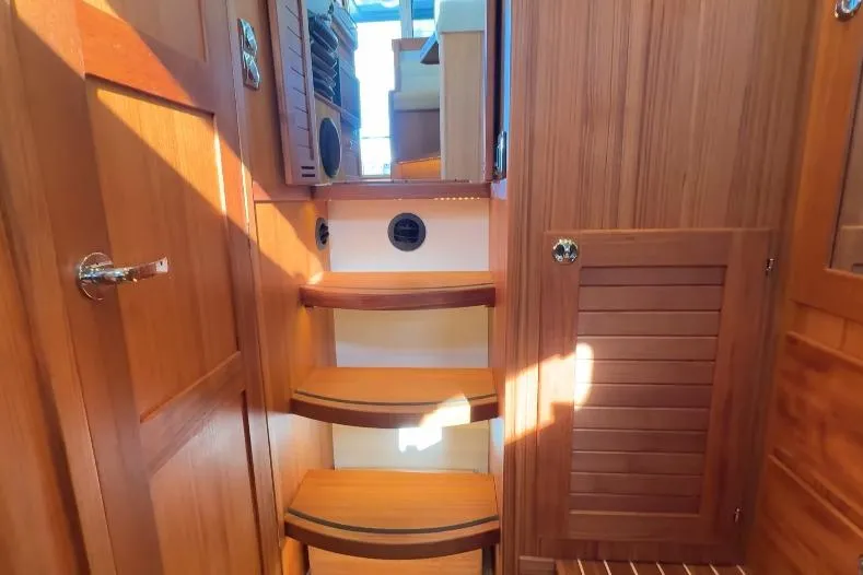 Slide: The Image of Interior of 2025 Targa 37 boat with wooden stairs and cabinetry. - 34