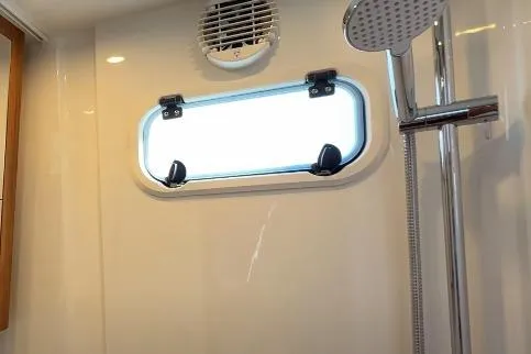 Slide: The Image of Shower area in 2025 Targa 37 boat with window and modern fixtures. - 36