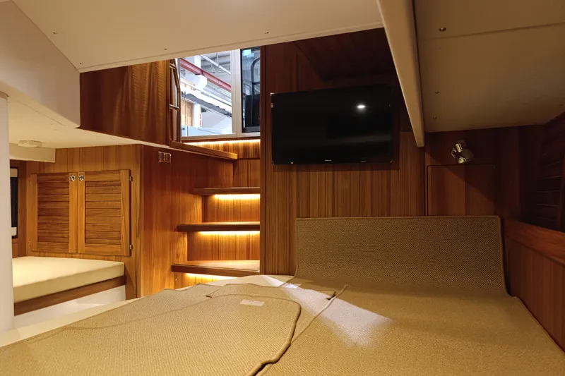 Slide: The Image of Luxurious interior of 2025 Targa 37 yacht with wood paneling and modern amenities. - 41