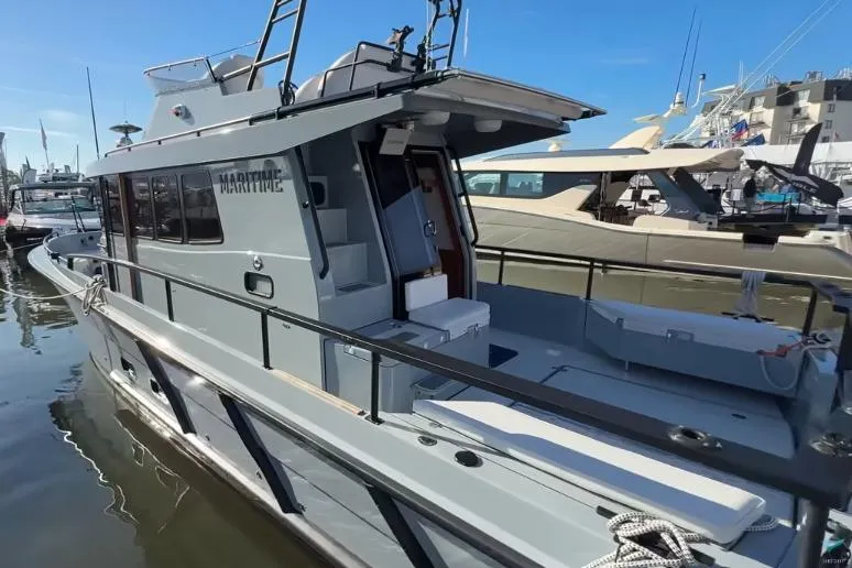 Slide: The Image of 2025 Targa 37 boat docked at marina, showcasing sleek design and modern features. - 8