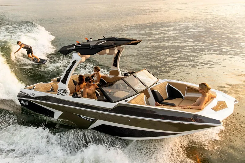 Slide: The Image of Manufacturer Provided Image: 2023 Tigé 24RZX boat with people wake surfing and relaxing on the water. - 11