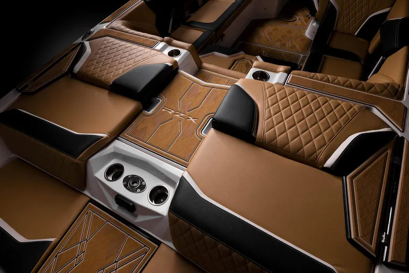 Slide: The Image of Manufacturer Provided Image: Luxurious interior of the 2023 Tigé 24RZX boat with brown and black upholstery. - 23