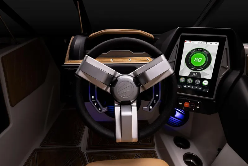 Slide: The Image of Manufacturer Provided Image: 2023 Tigé 24RZX boat dashboard with advanced touchscreen controls and modern steering wheel. - 27