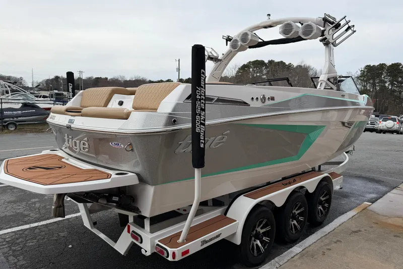 Slide: The Image of 2023 Tigé 24RZX boat on trailer, featuring sleek design and modern amenities. - 4