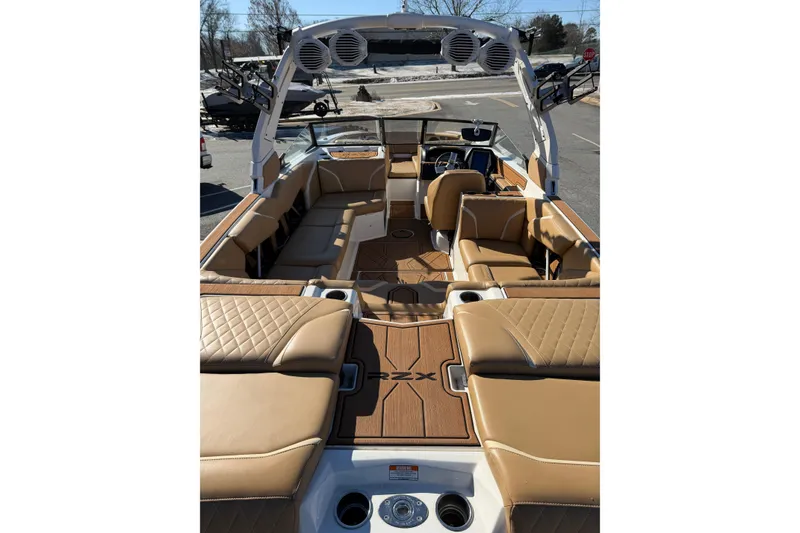 Slide: The Image of 2023 Tigé 24RZX boat interior with tan leather seating and modern design. - 6