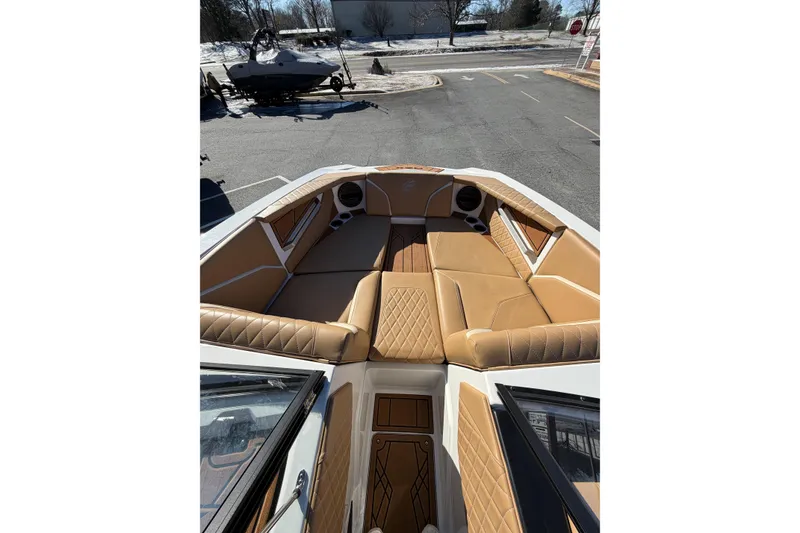 Slide: The Image of 2023 Tigé 24RZX boat interior with tan leather seating and modern design. - 9