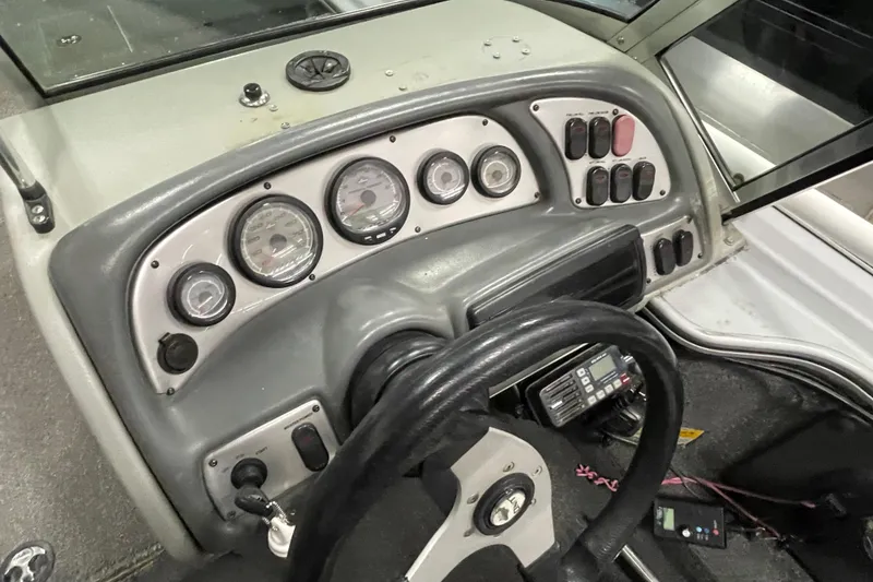 Slide: The Image of 2007 Lund 1900 Pro-V IFS/SE boat dashboard with gauges and controls. - 17