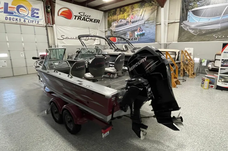 Slide: The Image of 2007 Lund 1900 Pro-V IFS/SE boat with Mercury outboard in showroom. - 3
