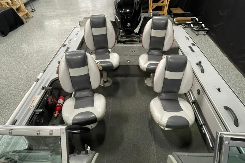 Slide: The Image of 2007 Lund 1900 Pro-V IFS/SE boat interior with four seats and motor. - 7