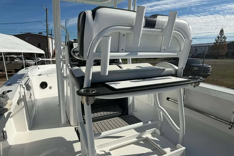 Slide: The Image of 2016 Crevalle 26 Bay boat interior with seating and rod holders. - 16