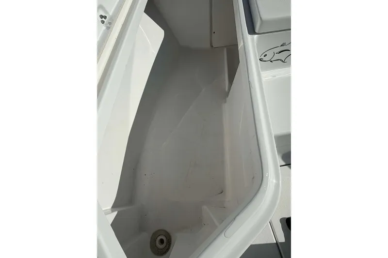Slide: The Image of Storage compartment of 2016 Crevalle 26 Bay boat, featuring clean interior design. - 18