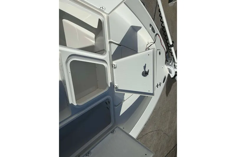 Slide: The Image of 2016 Crevalle 26 Bay boat storage compartments and hatch detail. - 20
