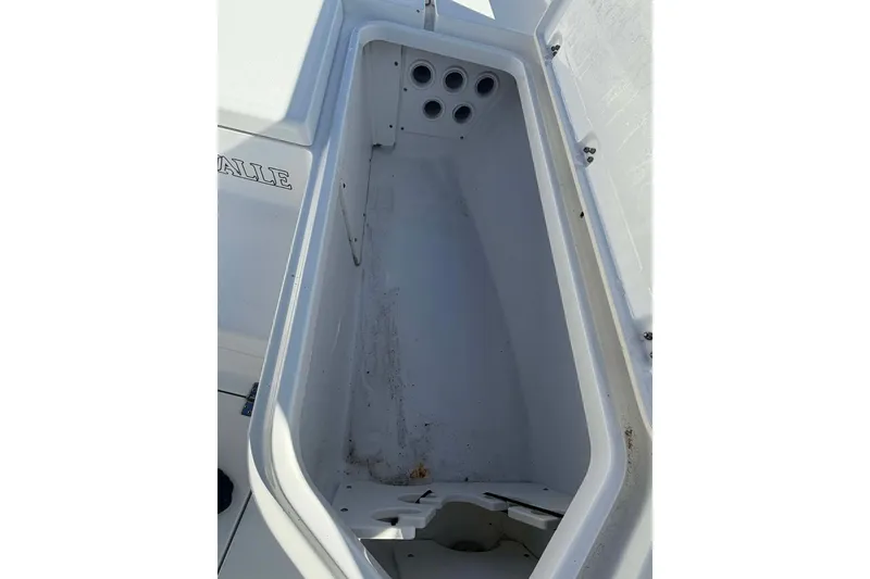 Slide: The Image of 2016 Crevalle 26 Bay boat storage compartment, open and empty. - 21