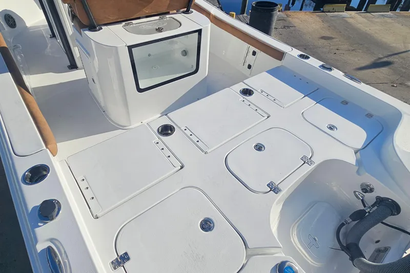 Slide: The Image of 2026 Sea Hunt BX 25 FS boat interior with storage compartments and seating. - 10