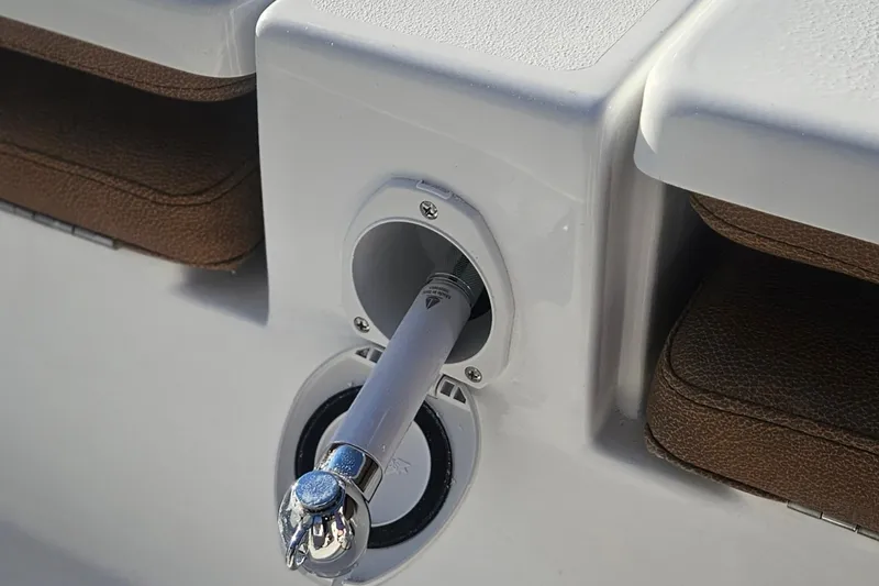 Slide: The Image of Close-up of a 2026 Sea Hunt BX 25 FS boat detail, featuring a rod holder. - 13