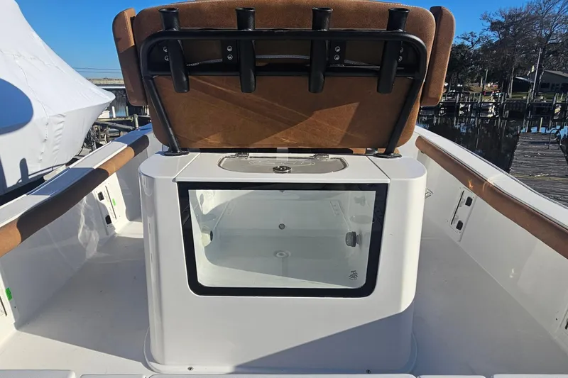 Slide: The Image of 2026 Sea Hunt BX 25 FS boat interior with seating and storage compartment. - 14