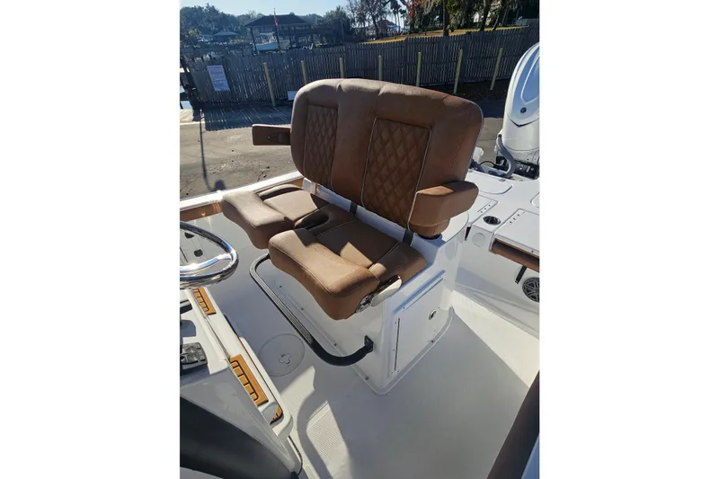 Slide: The Image of 2026 Sea Hunt BX 25 FS boat with luxurious brown seating and armrests. - 18