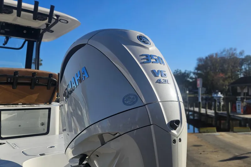 Slide: The Image of 2026 Sea Hunt BX 25 FS boat with Yamaha 350 V6 engine at dock. - 2