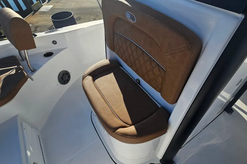 Slide: The Image of 2026 Sea Hunt BX 25 FS boat interior with brown cushioned seating. - 23