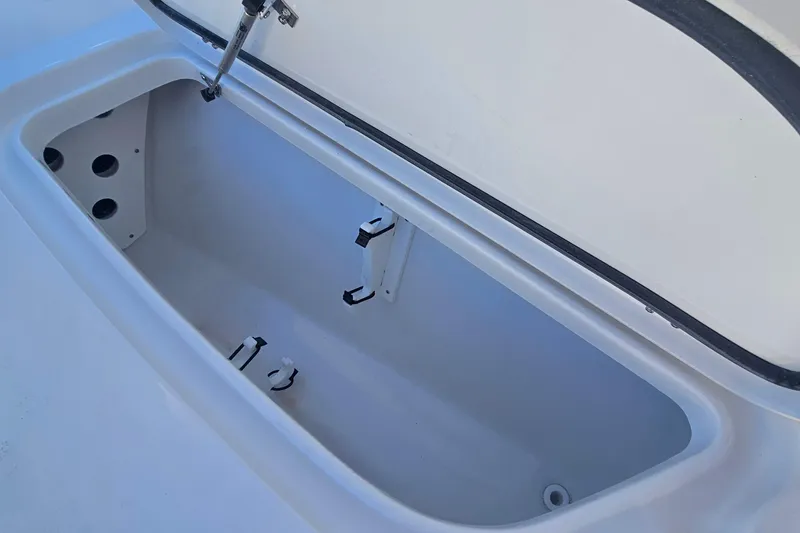 Slide: The Image of Open storage compartment of 2026 Sea Hunt BX 25 FS boat. - 26