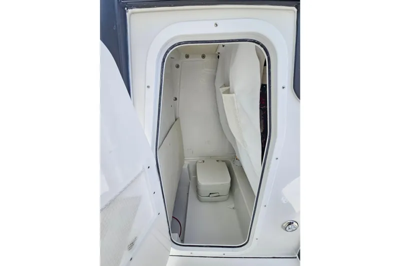 Slide: The Image of 2026 Sea Hunt BX 25 FS boat interior with compact marine toilet. - 27