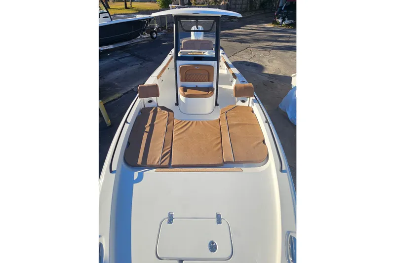 Slide: The Image of 2026 Sea Hunt BX 25 FS boat with tan seating and sleek design. - 28