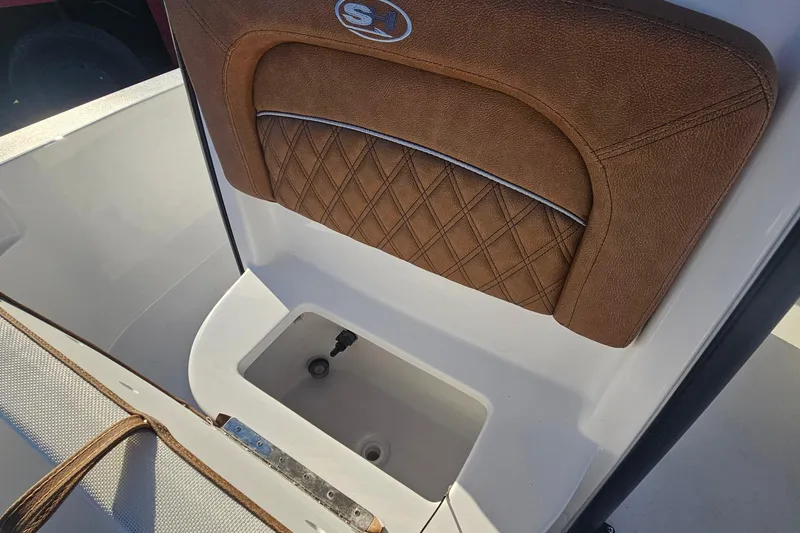Slide: The Image of 2026 Sea Hunt BX 25 FS boat seat with brown leather and storage compartment. - 29