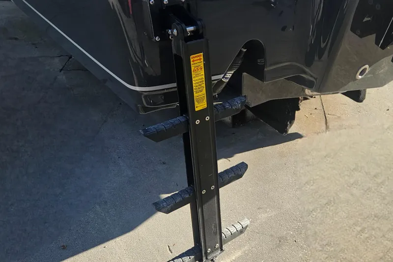 Slide: The Image of Rear view of 2026 Sea Hunt BX 25 FS boat with ladder extended. - 9