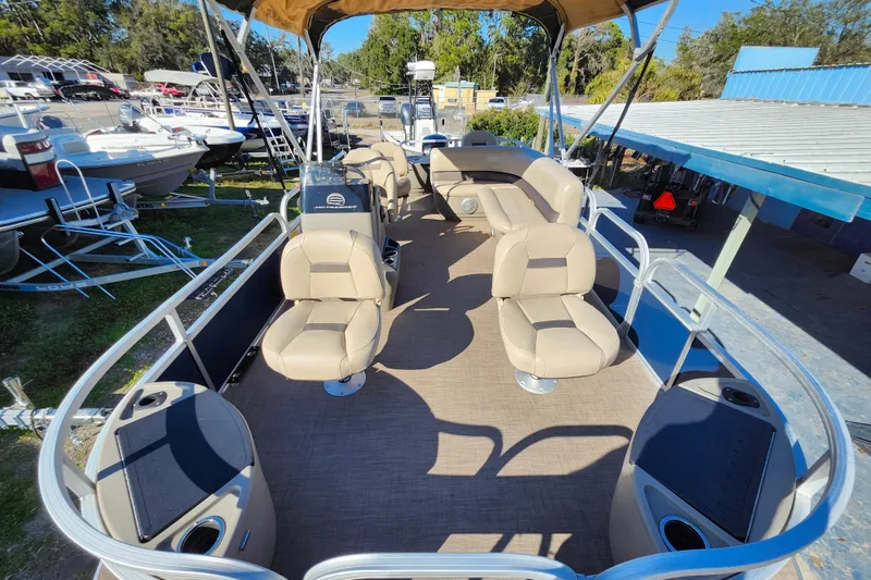 Slide: The Image of 2023 Sun Tracker Bass Buggy 18 DLX pontoon boat with spacious seating and canopy. - 11