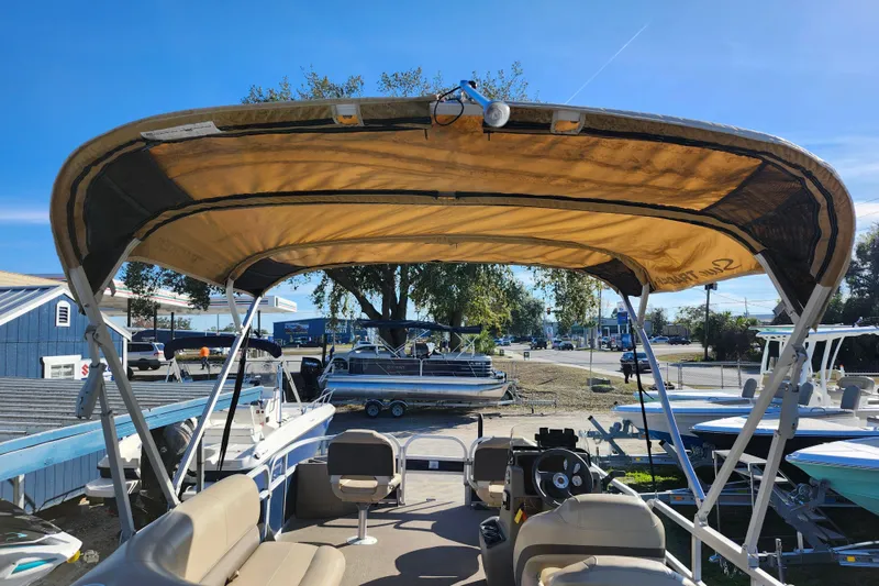 Slide: The Image of 2023 Sun Tracker Bass Buggy 18 DLX pontoon boat with canopy and seating. - 38