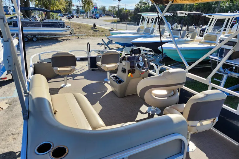 Slide: The Image of 2023 Sun Tracker Bass Buggy 18 DLX pontoon boat interior with seating and steering console. - 39