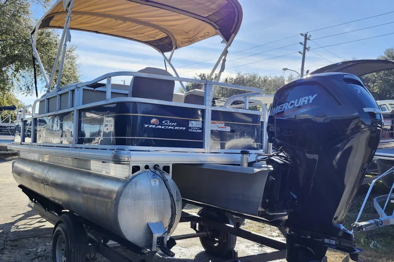 Slide: The Image of 2023 Sun Tracker Bass Buggy 18 DLX pontoon boat with Mercury outboard motor. - 4