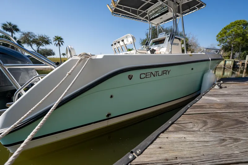 Slide: The Image of Century 2200 Center Console boat, 2007 model, docked on a sunny day. - 13
