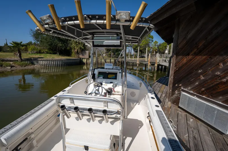 Slide: The Image of 2007 Century 2200 Center Console boat docked by wooden structure, sunny day. - 15