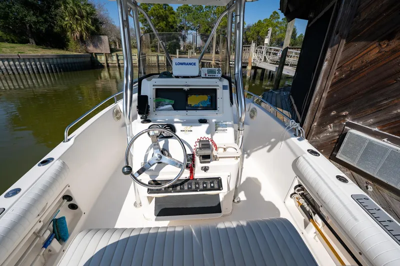 Slide: The Image of 2007 Century 2200 Center Console boat interior with navigation equipment and steering wheel. - 25