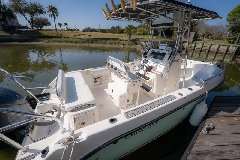 Slide: The Image of 2007 Century 2200 Center Console boat docked on a sunny day. - 28
