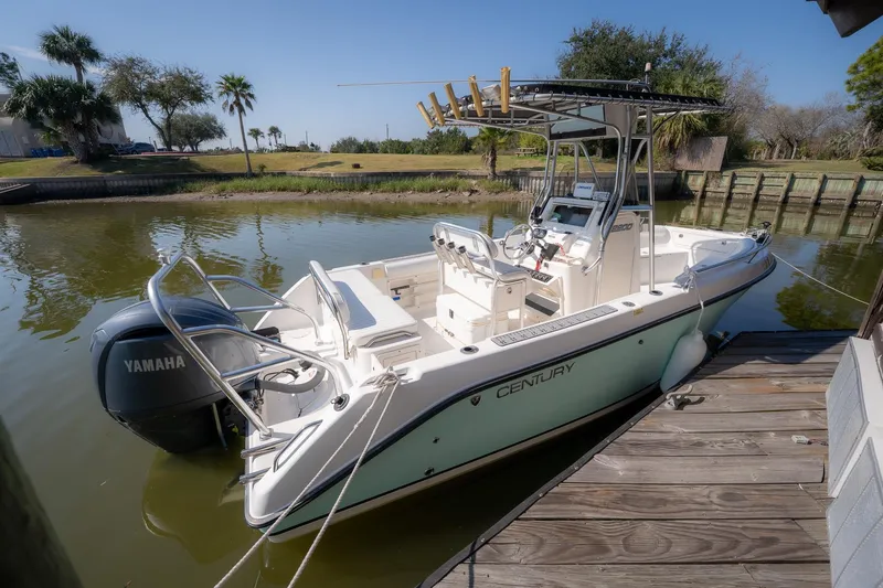 Slide: The Image of 2007 Century 2200 Center Console boat docked with Yamaha engine, sunny day. - 30