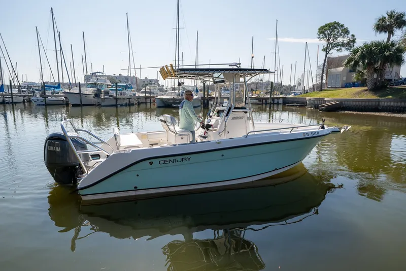 Slide: The Image of 2007 Century 2200 Center Console boat docked in a marina with Yamaha engine. - 6