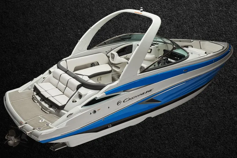 Slide: The Image of Manufacturer Provided Image: 2025 Crownline 278 SS boat with sleek design and blue accents on a dark background. - 2