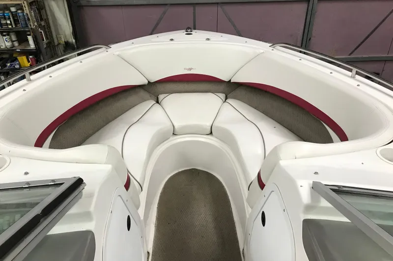 Slide: The Image of 2001 Four Winns 210 Horizon boat interior with white and red seating. - 12