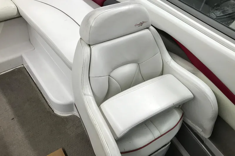 Slide: The Image of White leather seat in 2001 Four Winns 210 Horizon boat interior. - 16