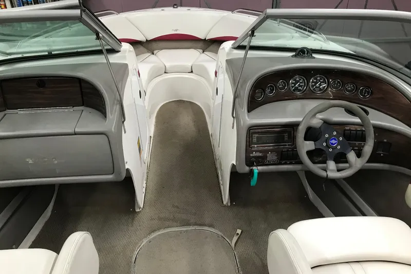 Slide: The Image of 2001 Four Winns 210 Horizon boat interior with dashboard and seating. - 19