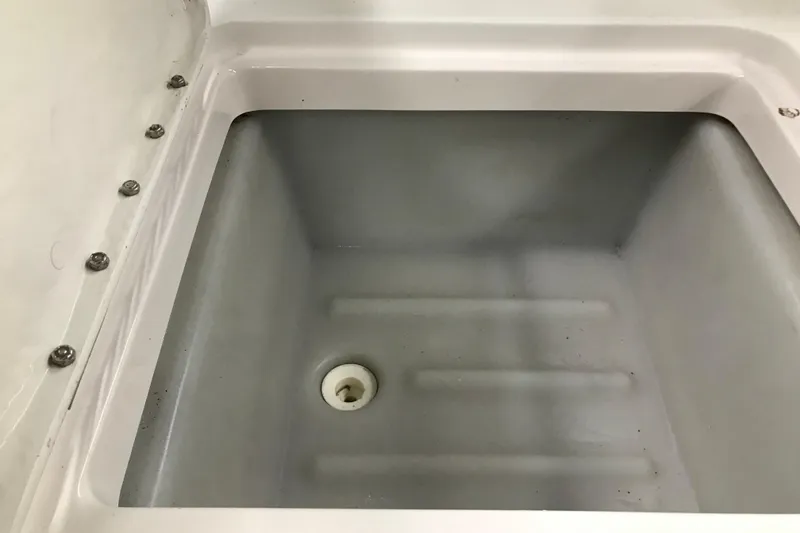 Slide: The Image of Storage compartment in a 2001 Four Winns 210 Horizon boat. - 23