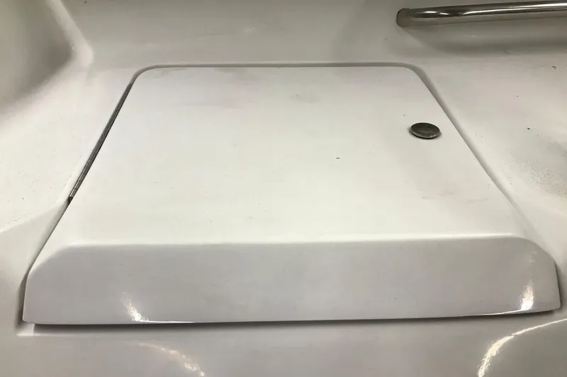 Slide: The Image of White hatch cover on 2001 Four Winns 210 Horizon boat interior. - 24