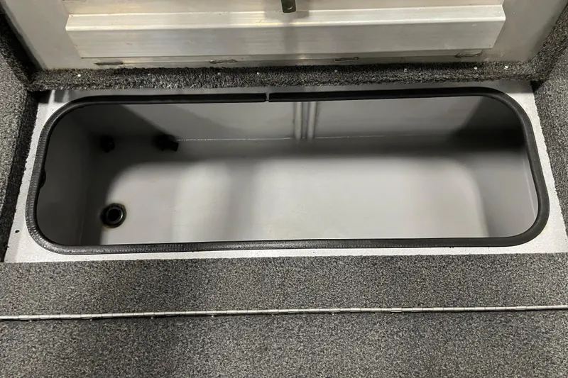 Slide: The Image of 2015 Triton 178 DV boat storage compartment, open and empty. - 12