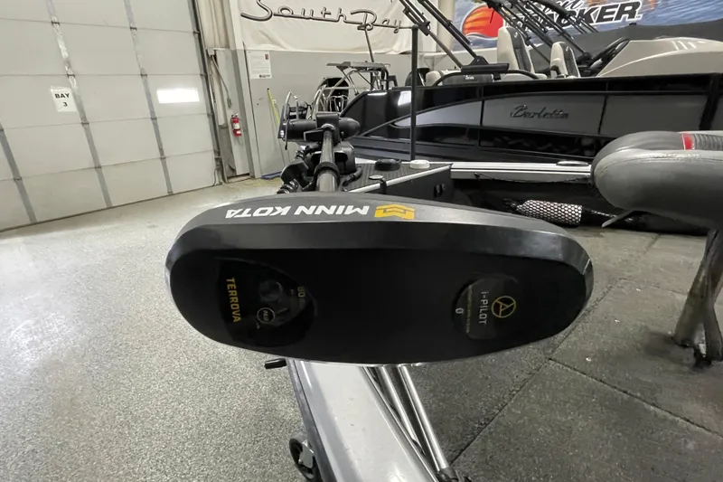 Slide: The Image of 2015 Triton 178 DV with Minn Kota Terrova trolling motor in a showroom. - 21