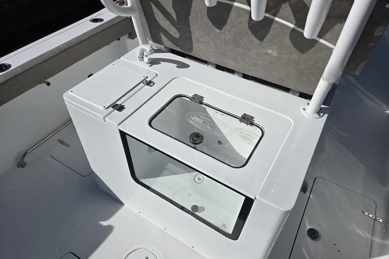 Slide: The Image of 2026 Sea Hunt Ultra 285 Coffin Box boat deck with storage compartment. - 10