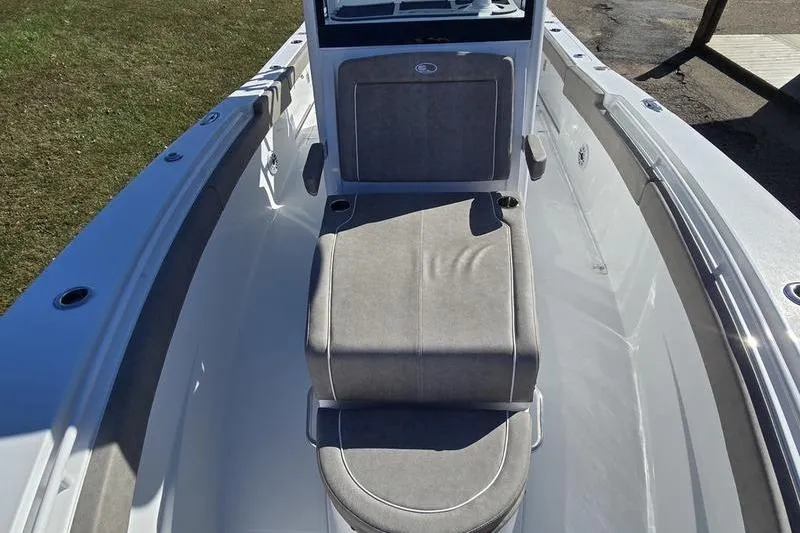 Slide: The Image of 2026 Sea Hunt Ultra 285 Coffin Box boat interior with cushioned seating. - 13