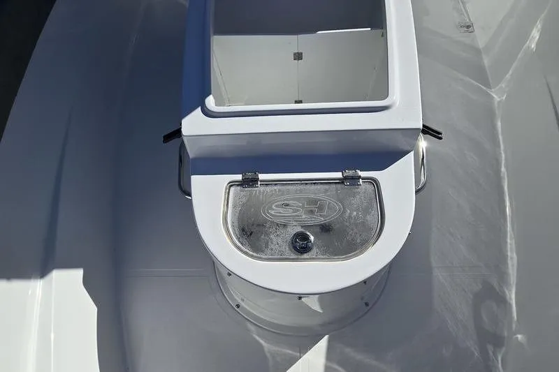 Slide: The Image of 2026 Sea Hunt Ultra 285 Coffin Box, open storage compartment on deck. - 15
