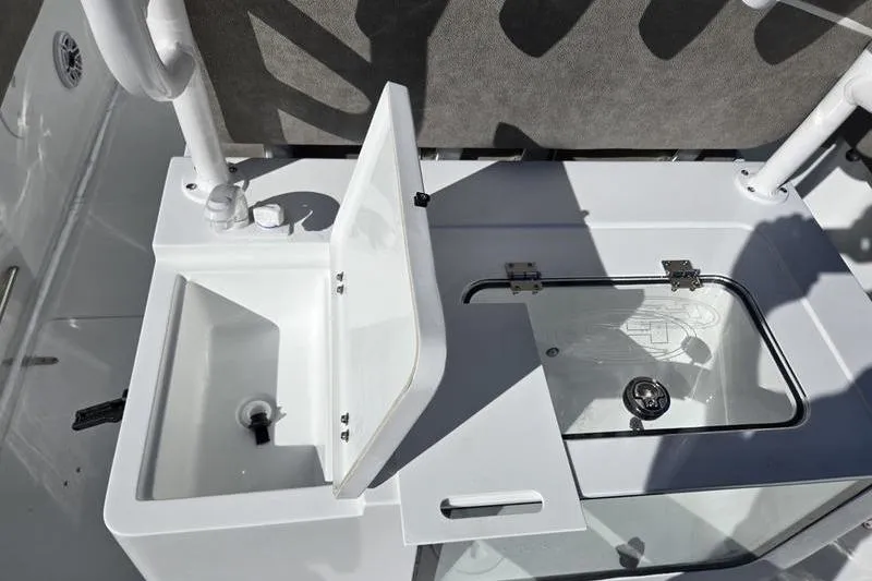 Slide: The Image of 2026 Sea Hunt Ultra 285 Coffin Box boat sink and storage compartment. - 27